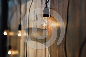 Light bulb decor at wall in outdoor party