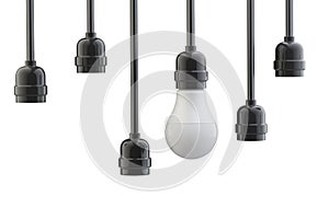 Light bulb in electric cartridge on wires, the other cartridges are empty. Leadership concept