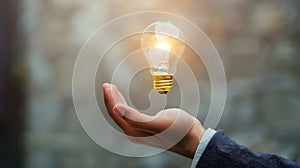 light bulb floting on businessman hand,concept of growing business.