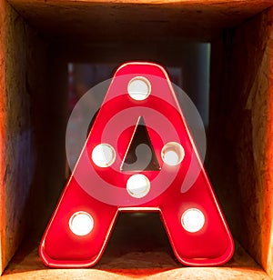 Light bulb glowing letter alphabet character A font