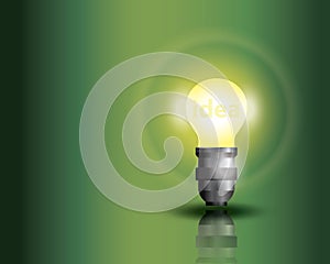 Light bulb on green background