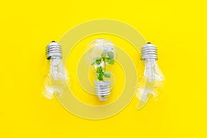 Light bulb with green grass - renewable energy eco concept