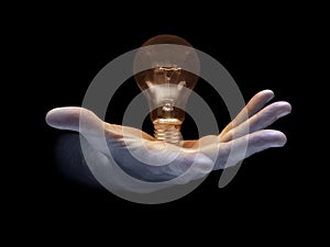 Light bulb in hand - Stock Image