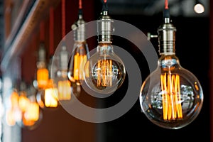 Light bulb hanging from the ceiling in a retro style closeup