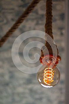 Light bulb hanging on a rope