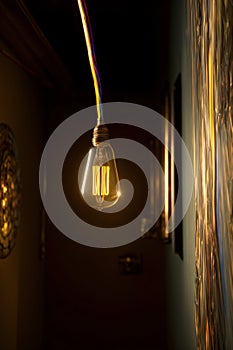 A Light Bulb Hanging From The Side Of A Wall. Generative AI