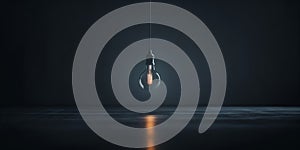 A light bulb hanging from a string in a dark room