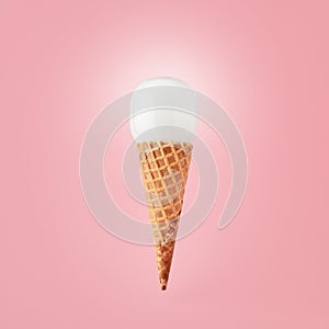 Light bulb on ice cream cone on pink background. Creativity, innovation, idea or discovery