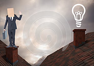 Light bulb icon and Businessman standing on Roofs with chimney and cardboard box on his head and dra