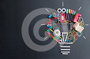 Light bulb icon made from stationery