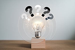Light bulb idea with question marks concept for problem solving and creative thinking solutions concept