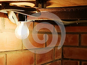 Light bulb illuminating the dark corner of the basement