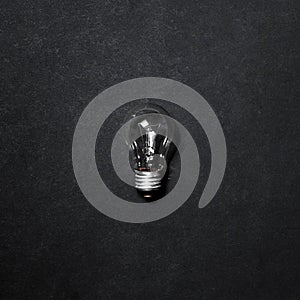 Light bulb isolated on gray background, top view. Creative Idea Concept