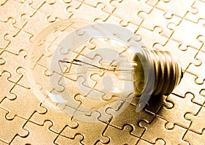 Light bulb on jigsaws