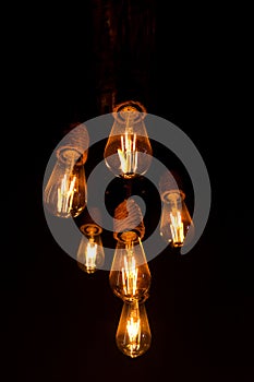 Light bulb lamp electric dark background, design energy glass vintage black bright