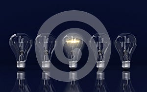 Light bulb and row of lamps on a colour background