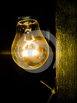 Light bulb shinning in the dark