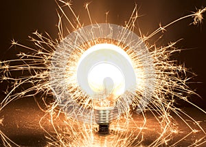 Light bulb with sparks background