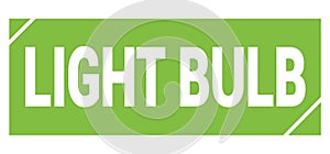 LIGHT BULB text written on green stamp sign