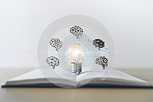 Light bulb with textbook. Success idea business learning and knowledge