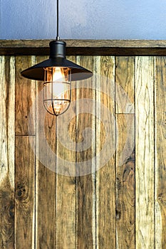 Light bulb on wood wall