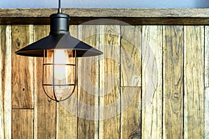 Light bulb on wood wall