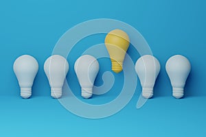 Light bulb yellow floating outstanding among lightbulb light blue on background. Concept of creative idea and