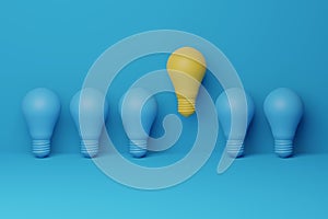 Light bulb yellow floating outstanding among lightbulb light blue on background. Concept of creative idea and