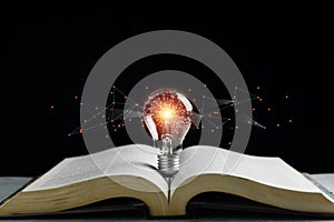 Light bulbs with polygon abstract brain on books. business learning inspiration creativity.