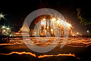 The light from the candle lit at night around the Church of Buddhist Lent.