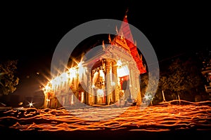 The light from the candle lit at night around the Church of Buddhist Lent.