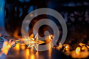 Light chain and candles create a cosy atmosphere. Romantic. Christmas photo