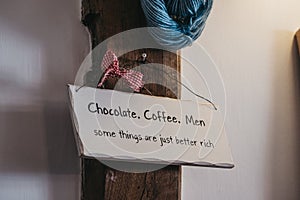 Light coloured humour sign joking about the chocolate, coffee and men