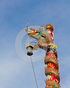 Light column dragon from Chinese Temple on sky background