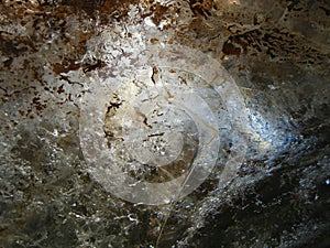 Light comes through ice in an ice cave