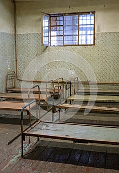 Light Coming in Through Prison Cell Bars Window. Empty Jail Cells. Prison Interior.