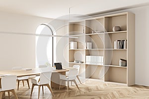 Light conference room interior with furniture, shelf and window with countryside