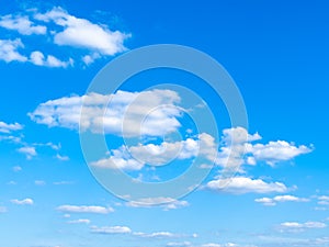 Light cumuli clouds in blue sky on sunny day