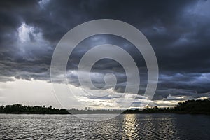 Light in the Dark and Dramatic Storm Clouds background