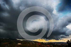 Light in the dark and dramatic storm clouds background. Storm clouds. Supercell Storm Cumulonimbus