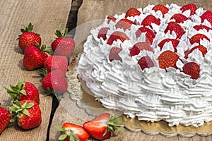 Light, delicate and tasty cream cake with fresh strawberries (half cake)