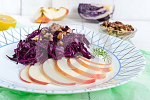 Light diet vegan salad of red cabbage, apple and walnuts. The Lenten dish.