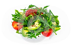 Light dietary salad from arugula, avocado, tomates and flax seed