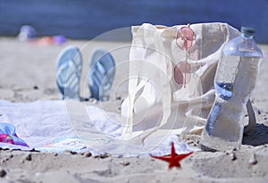 A light eco bag stands on a caved shore