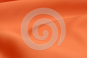 Light effects on orange fabric