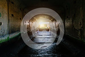 Light at the end of dark dirty sewer tunnel