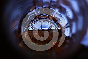 Light in the end of a tunnel (a bottom of a beer mug with beer)