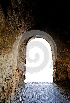 light at the end of a tunnel dug into the rock symbol of hope of