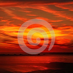 Light fiery sunset on the beautiful and bright ocean horizon