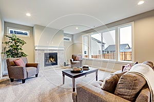 Light filled living room furnished with grey linen furniture